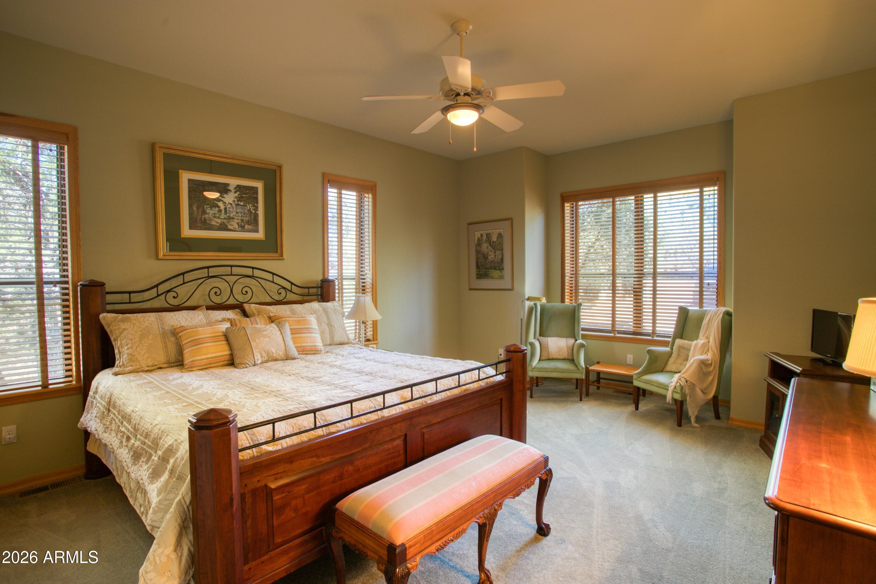 3990 Sugar Pine Loop Show Low, AZ 85901 - Photo 23 of 62 a bedroom with a bed and a chandelier