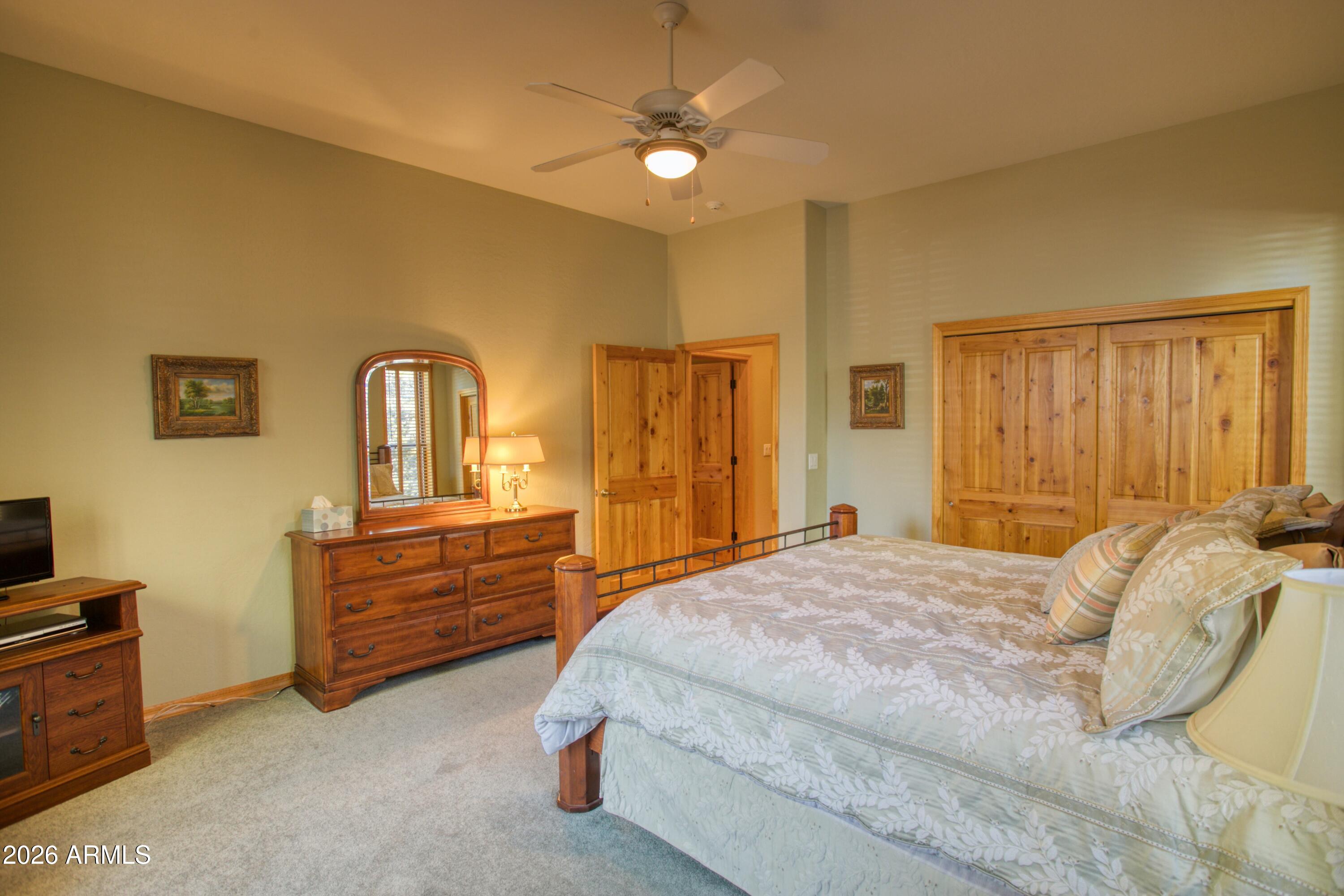 3990 Sugar Pine Loop Show Low, AZ 85901 - Photo 24 of 62 a bedroom with a bed and a dresser