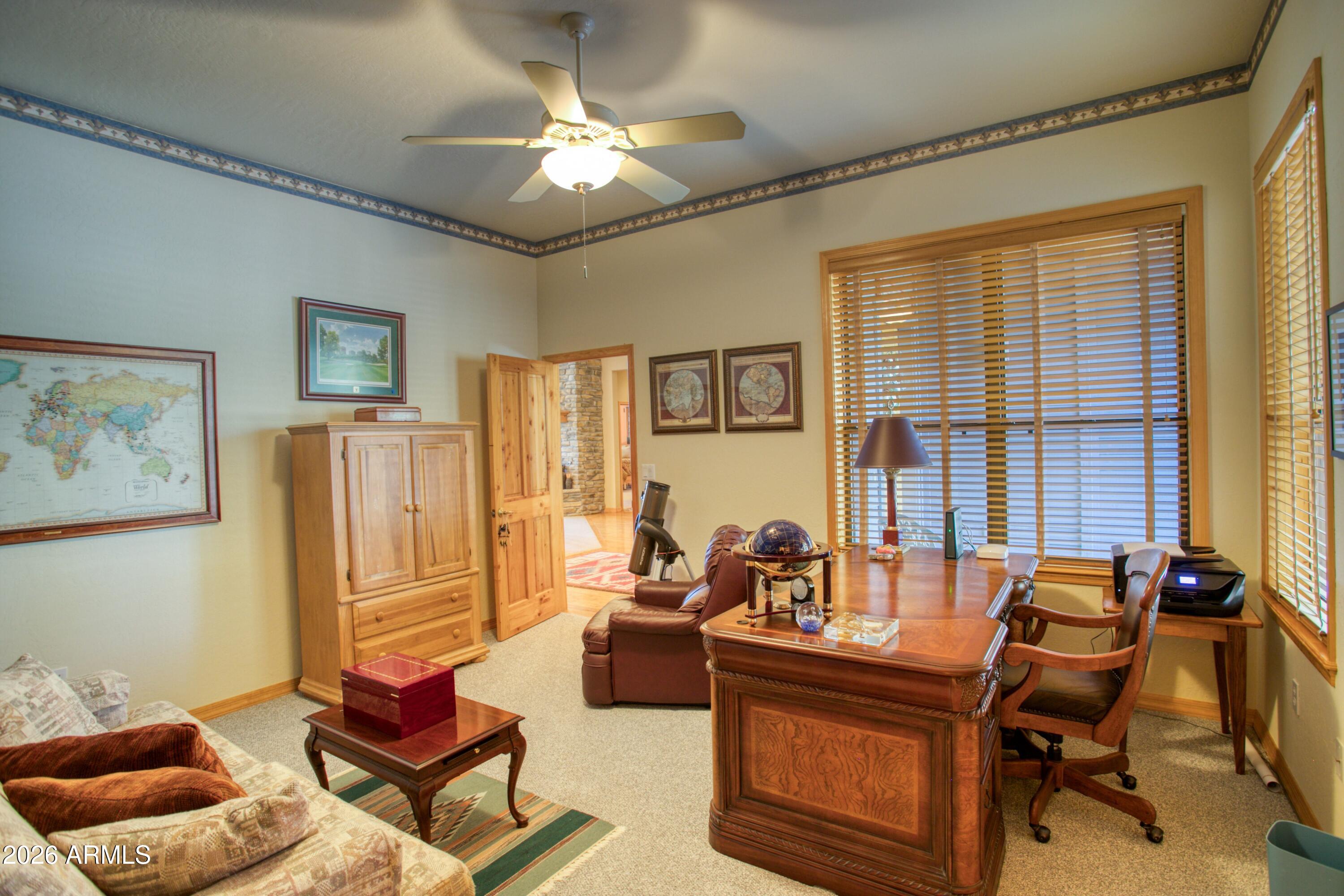 3990 Sugar Pine Loop Show Low, AZ 85901 - Photo 27 of 62 a living room with furniture and a window
