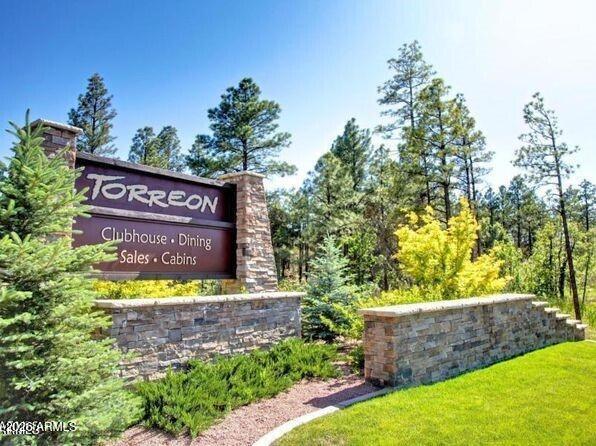 3990 Sugar Pine Loop Show Low, AZ 85901 - Photo 42 of 62 a sign that is sitting in front of flowers