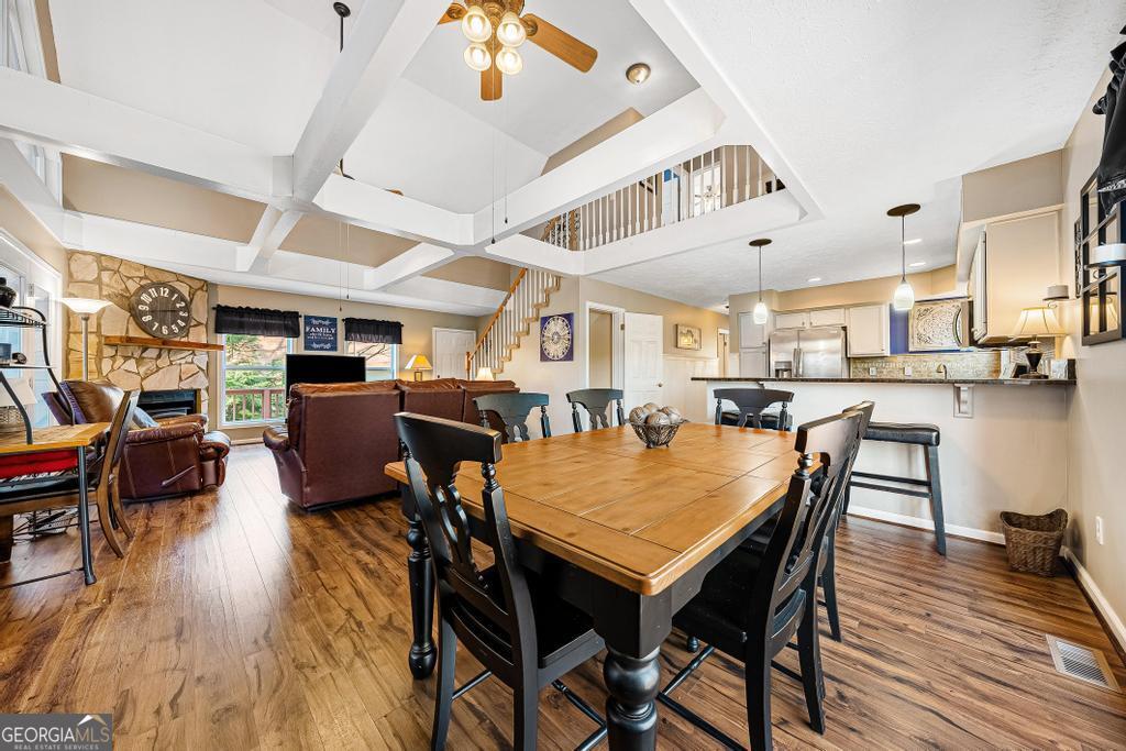 997 Rue Fluer De Lis Lavonia, GA 30553 - Photo 11 of 38 a dining room with furniture and wooden floor
