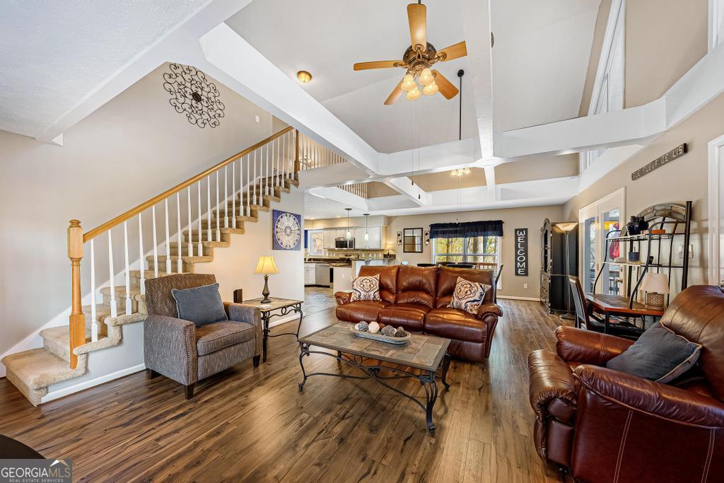 997 Rue Fluer De Lis Lavonia, GA 30553 - Photo 14 of 38 a living room with furniture ceiling fan and a rug