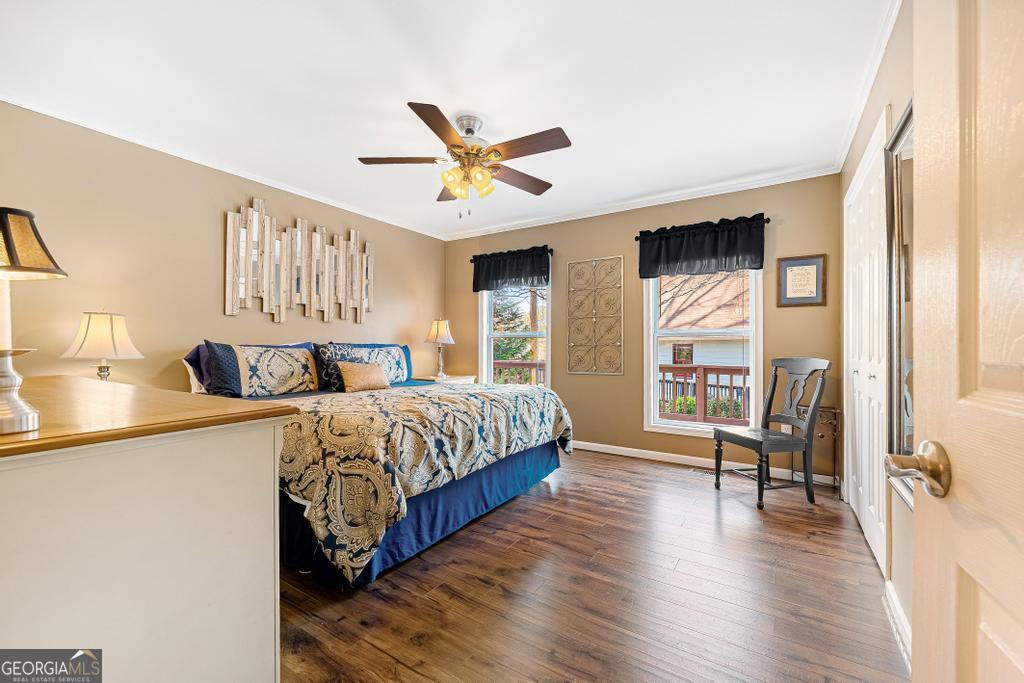 997 Rue Fluer De Lis Lavonia, GA 30553 - Photo 15 of 38 a spacious bedroom with a bed and a window