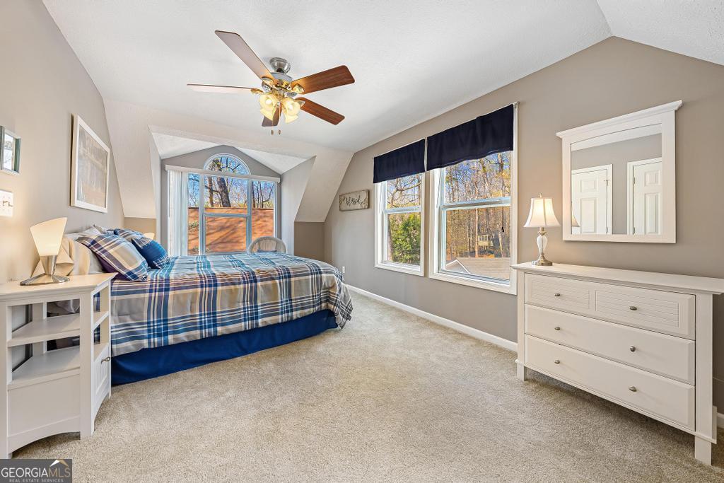 997 Rue Fluer De Lis Lavonia, GA 30553 - Photo 18 of 38 a bedroom with furniture and windows