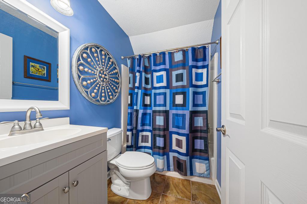 997 Rue Fluer De Lis Lavonia, GA 30553 - Photo 19 of 38 a bathroom with a toilet and a sink