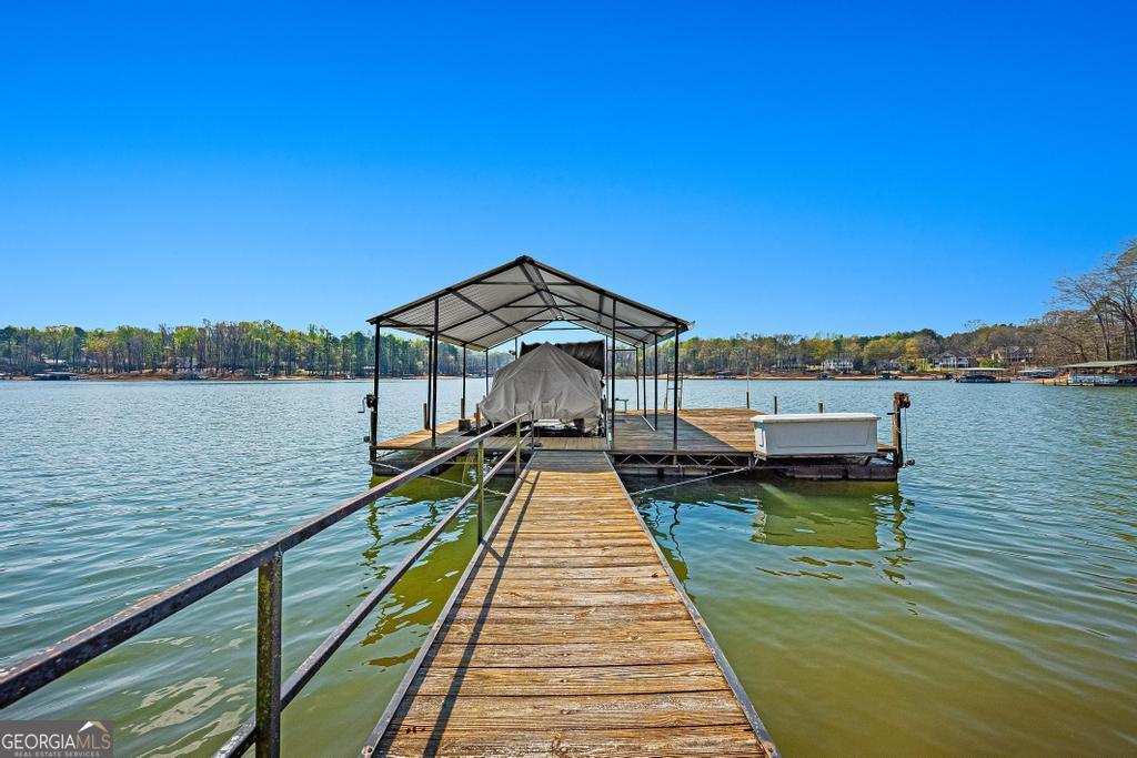 997 Rue Fluer De Lis Lavonia, GA 30553 - Photo 2 of 38 a house view with a lake view