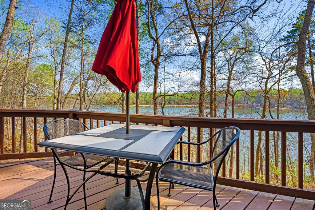 997 Rue Fluer De Lis Lavonia, GA 30553 - Photo 26 of 38 a view of a two chairs and table on the deck