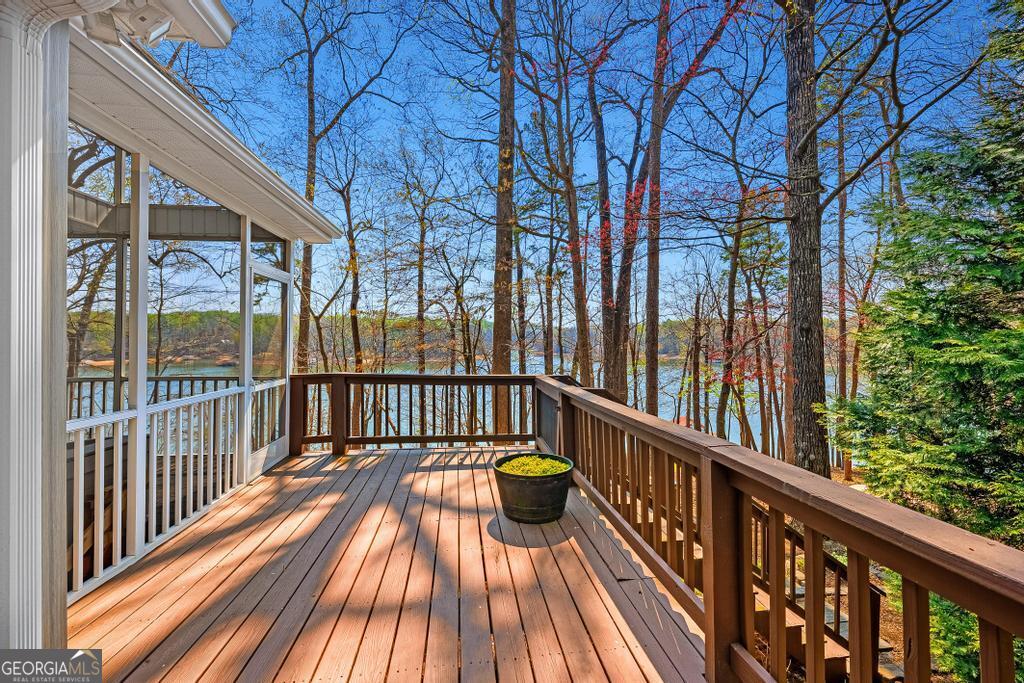 997 Rue Fluer De Lis Lavonia, GA 30553 - Photo 27 of 38 a view of balcony with wooden floor and fence