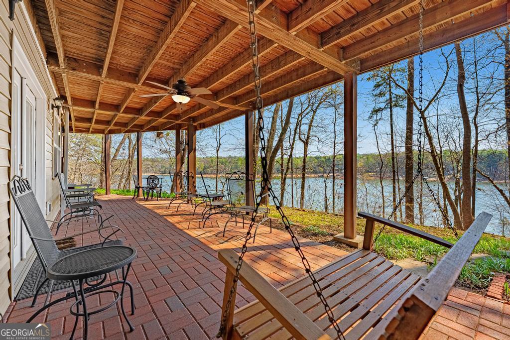 997 Rue Fluer De Lis Lavonia, GA 30553 - Photo 29 of 38 a view of a patio with wooden floor