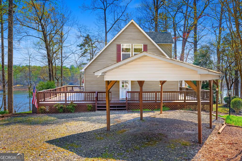 997 Rue Fluer De Lis Lavonia, GA 30553 - Photo 35 of 38 a front view of a house with a yard