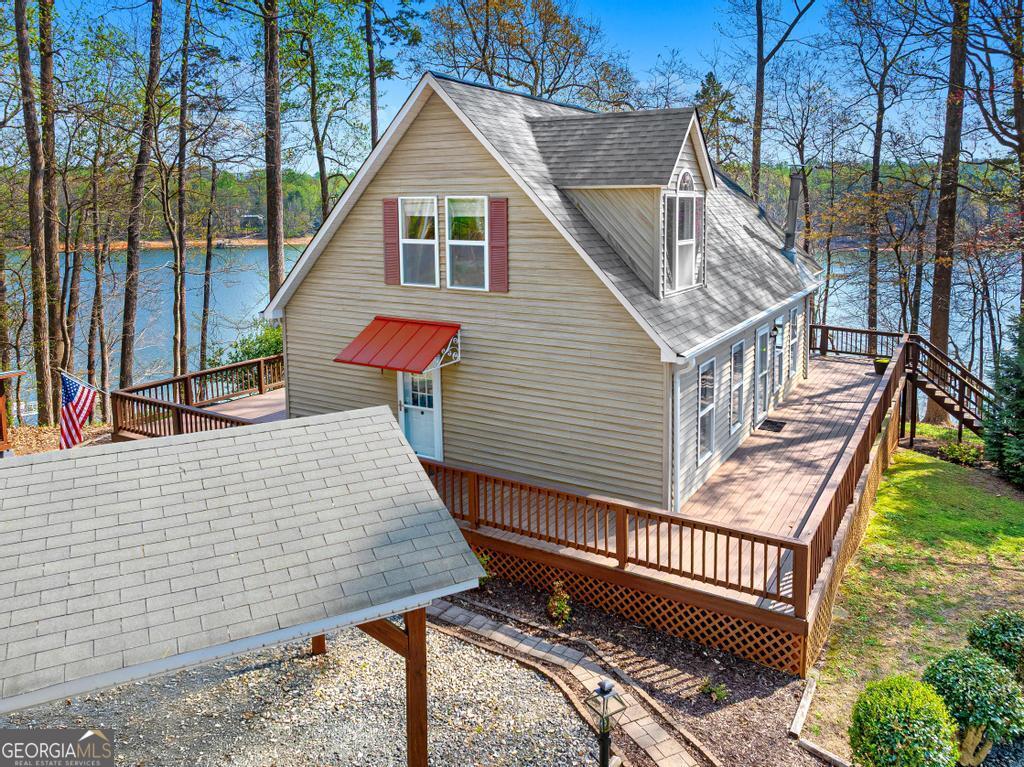 997 Rue Fluer De Lis Lavonia, GA 30553 - Photo 6 of 38 a view of a roof deck with wooden floor and fence