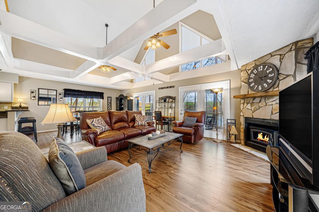 997 Rue Fluer De Lis Lavonia, GA 30553 - Photo 8 of 38 a living room with furniture kitchen view and a large window