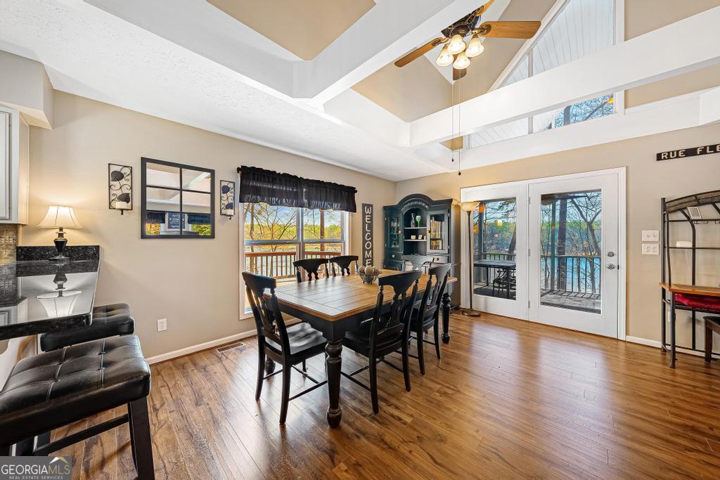 997 Rue Fluer De Lis Lavonia, GA 30553 - Photo 10 of 38 a view of a dining room with furniture window and wooden floor