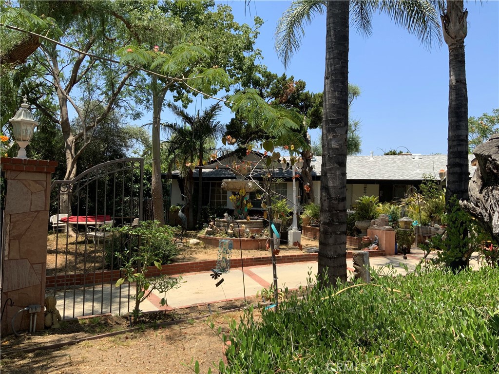 14401 Lakeside Street Sylmar, CA 91342 - Photo 2 of 2 a view of a street with potted plants