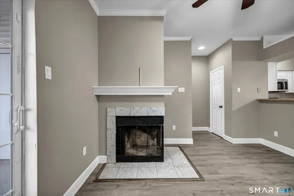 a living room with a fireplace and a fireplace
