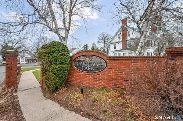 a sign board with a small yard