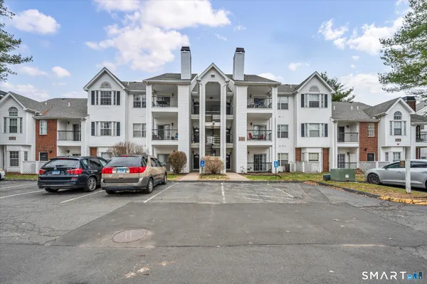 a view of street with parked cars