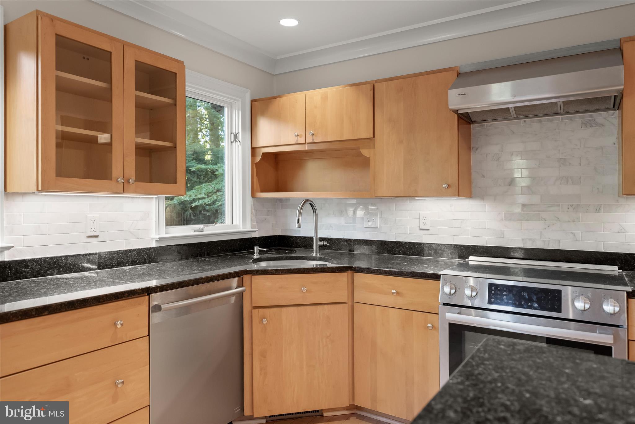 5104 Scarsdale Road Bethesda, MD 20816 - Photo 16 of 68 a kitchen with stainless steel appliances granite countertop a sink and a granite counter tops