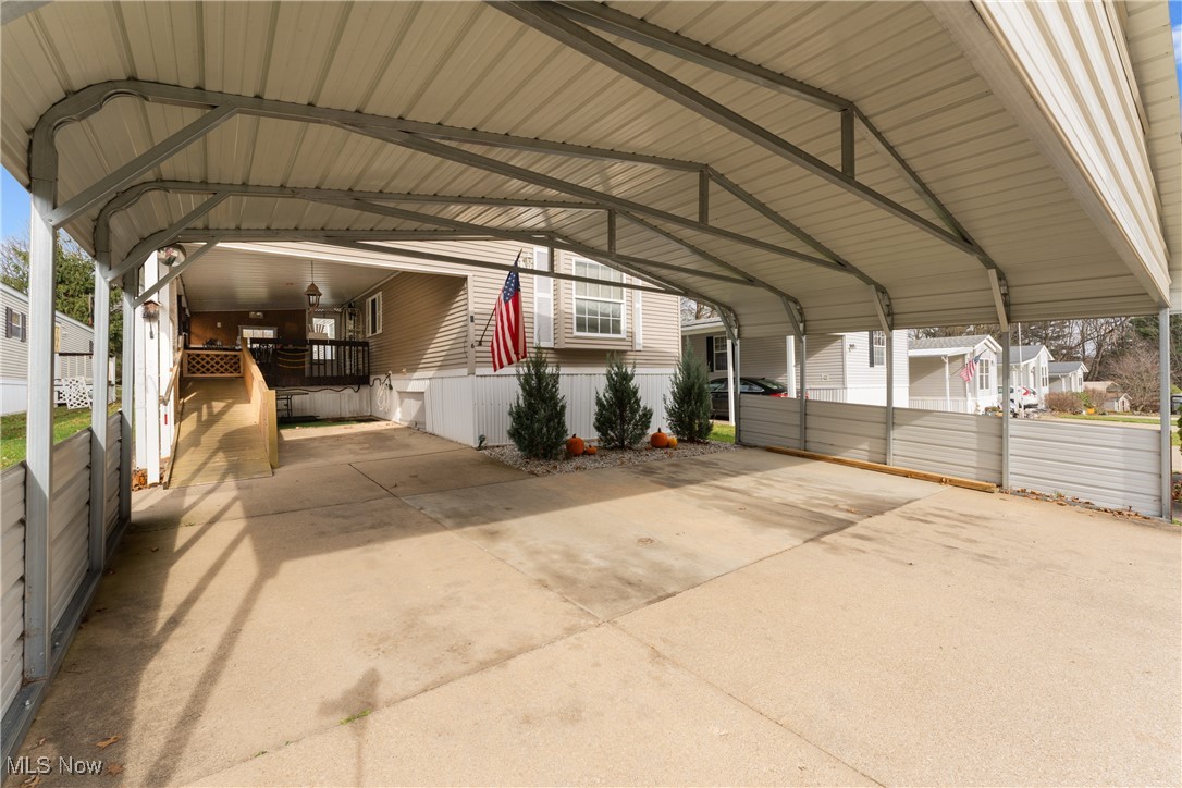 4455 Cleveland Road, Unit 6 Wooster, OH 44691 - Photo 40 of 40 View of parking featuring a carport