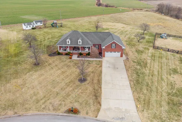 a aerial view of a house with a yard