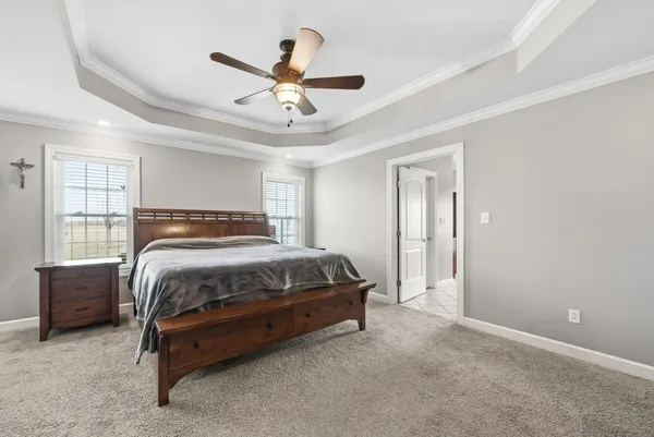 a bedroom with a bed and window