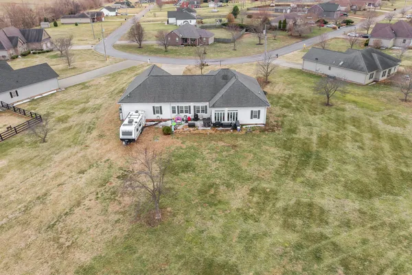 an aerial view of a house with a lake view