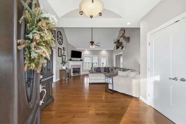 a living room with furniture and a fireplace