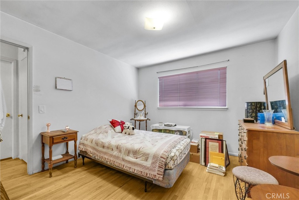 2551 Rome Avenue Anaheim, CA 92804 - Photo 21 of 27 a bedroom with a bed and a chair