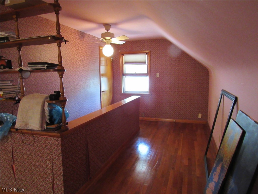 934 Nevin Street Akron, OH 44310 - Photo 8 of 22 Hallway featuring dark hardwood floors and lofted ceiling