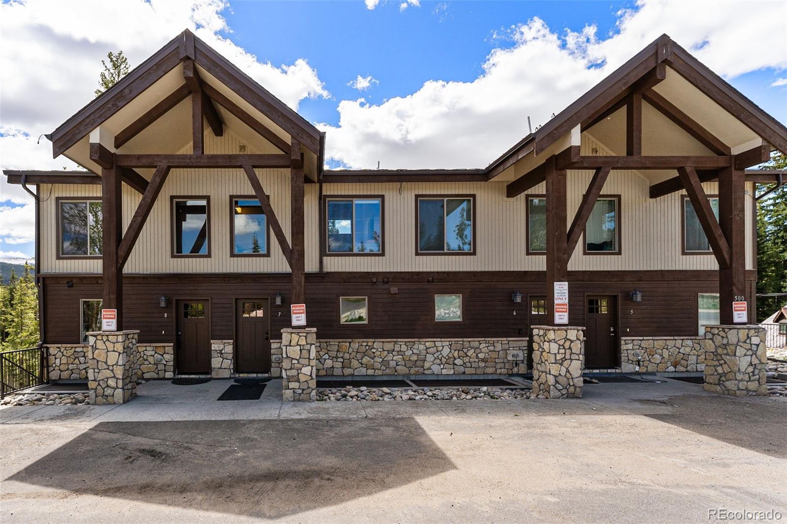 500 Vasquez Road, Unit 7A Winter Park, CO 80482 - Photo 1 of 49 a front view of a house with a yard