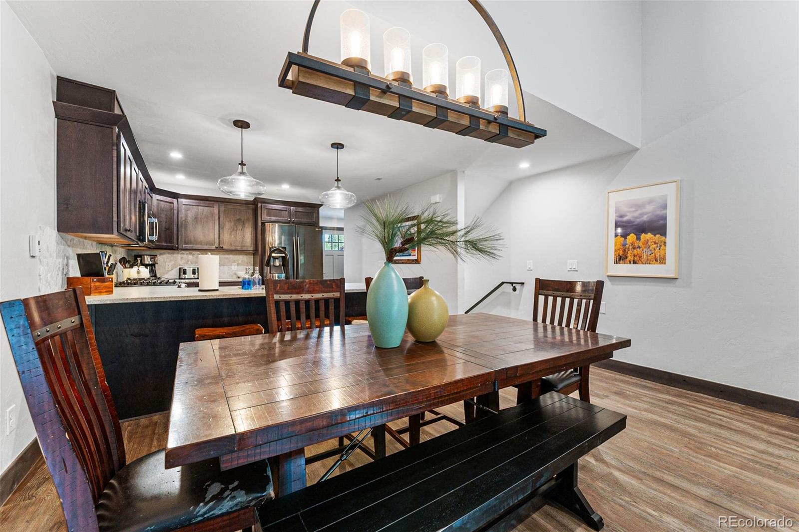 500 Vasquez Road, Unit 7A Winter Park, CO 80482 - Photo 15 of 49 a view of kitchen and dining room with wooden floor