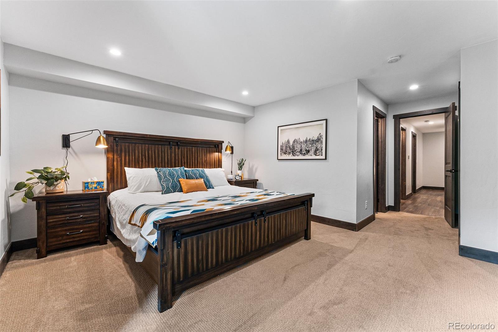 500 Vasquez Road, Unit 7A Winter Park, CO 80482 - Photo 23 of 49 a bed room with a bed and a night stand