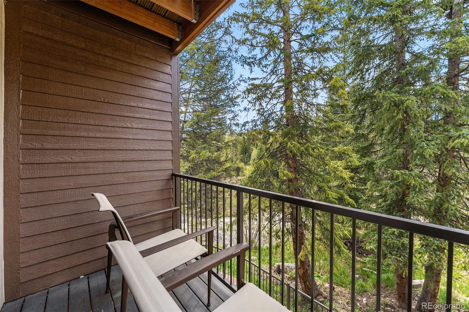 500 Vasquez Road, Unit 7A Winter Park, CO 80482 - Photo 25 of 49 a view of a balcony with wooden floor