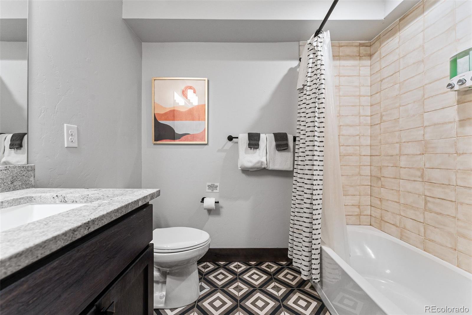 500 Vasquez Road, Unit 7A Winter Park, CO 80482 - Photo 28 of 49 a bathroom with a sink a toilet and shower