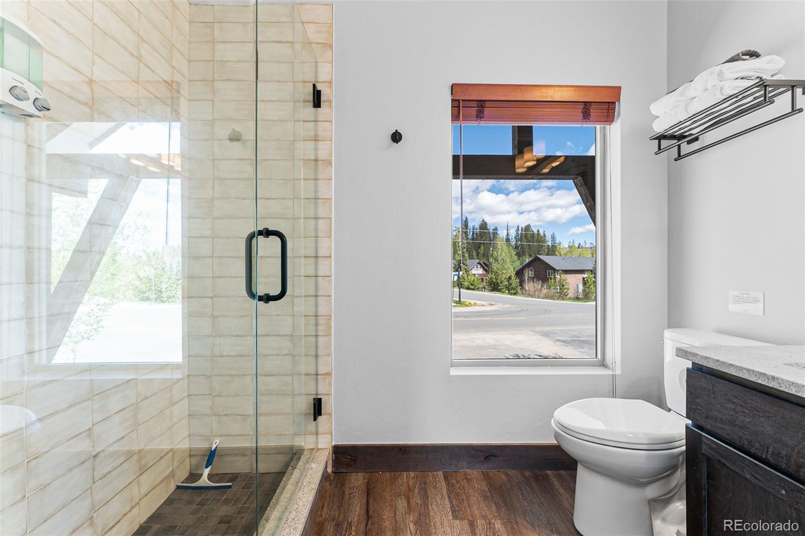 500 Vasquez Road, Unit 7A Winter Park, CO 80482 - Photo 32 of 49 a bathroom with a toilet a sink and a shower