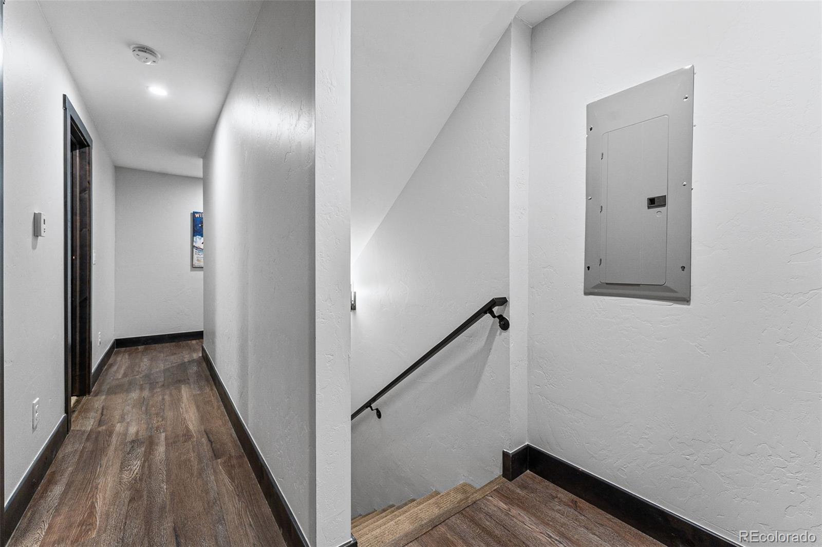 500 Vasquez Road, Unit 7A Winter Park, CO 80482 - Photo 36 of 49 a view of a hallway with wooden floor and staircase