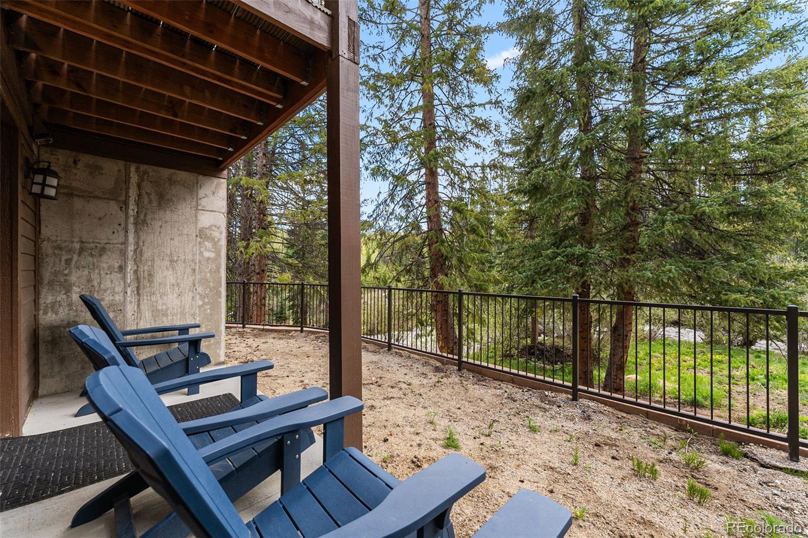 500 Vasquez Road, Unit 7A Winter Park, CO 80482 - Photo 44 of 49 a view of a balcony with wooden floor and outdoor seating