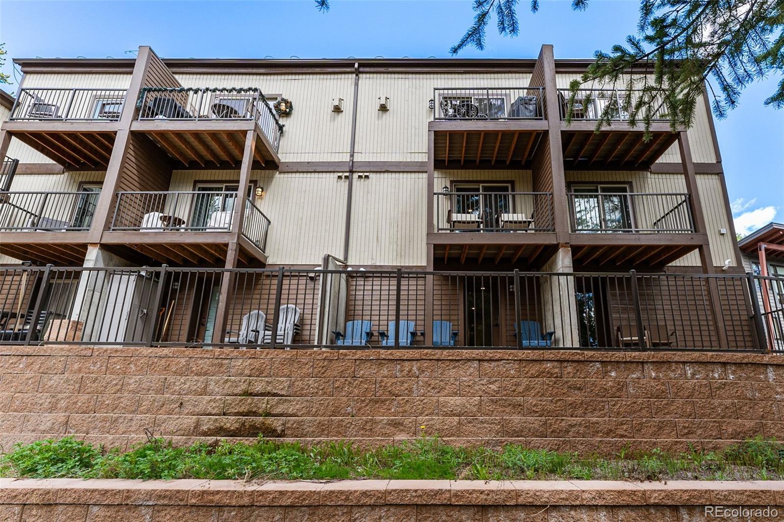 500 Vasquez Road, Unit 7A Winter Park, CO 80482 - Photo 46 of 49 a view of building with large windows and a bench