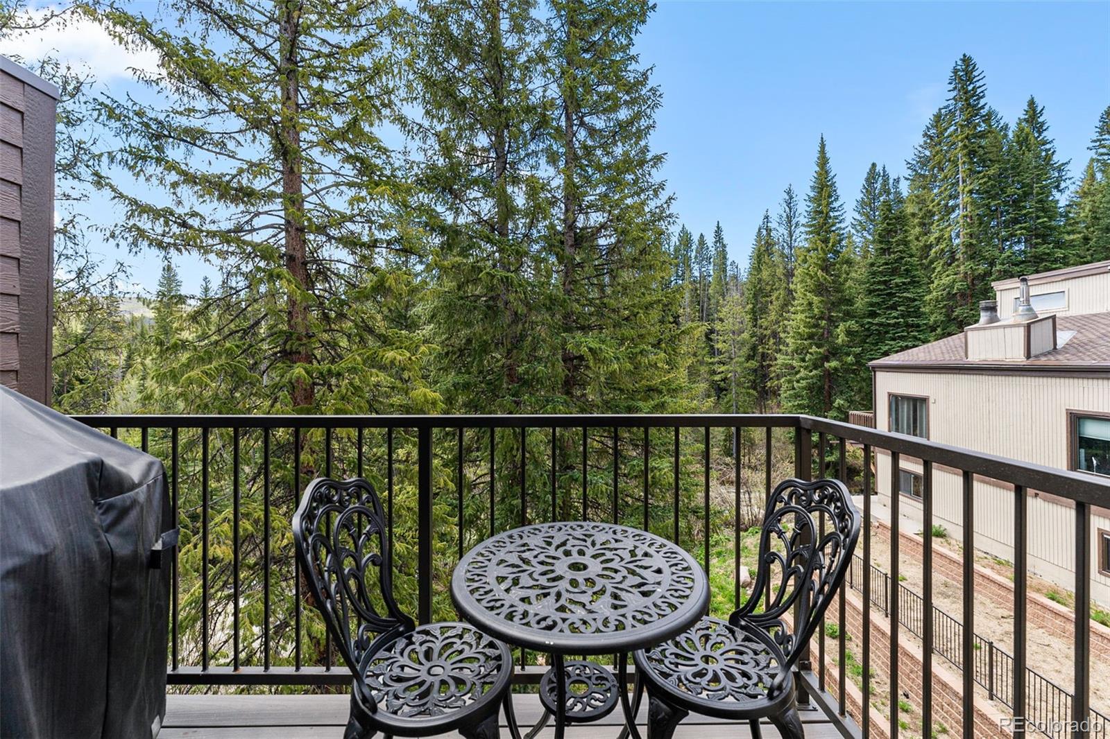 500 Vasquez Road, Unit 7A Winter Park, CO 80482 - Photo 8 of 49 a view of roof deck with wooden fence and trees