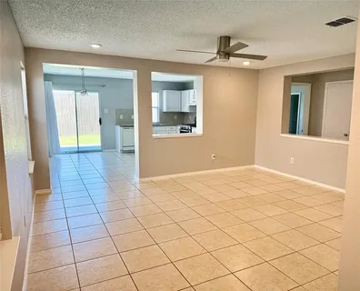 a view of an empty room and bathroom