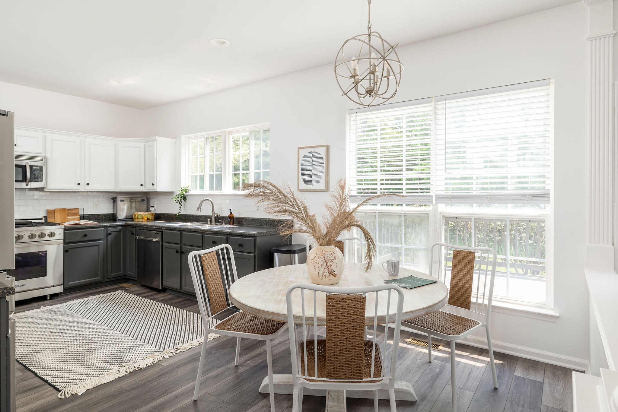 310 Devonshire Drive Franklin, TN 37064 - Photo 12 of 47 a view of a dining room with furniture large windows and wooden floor