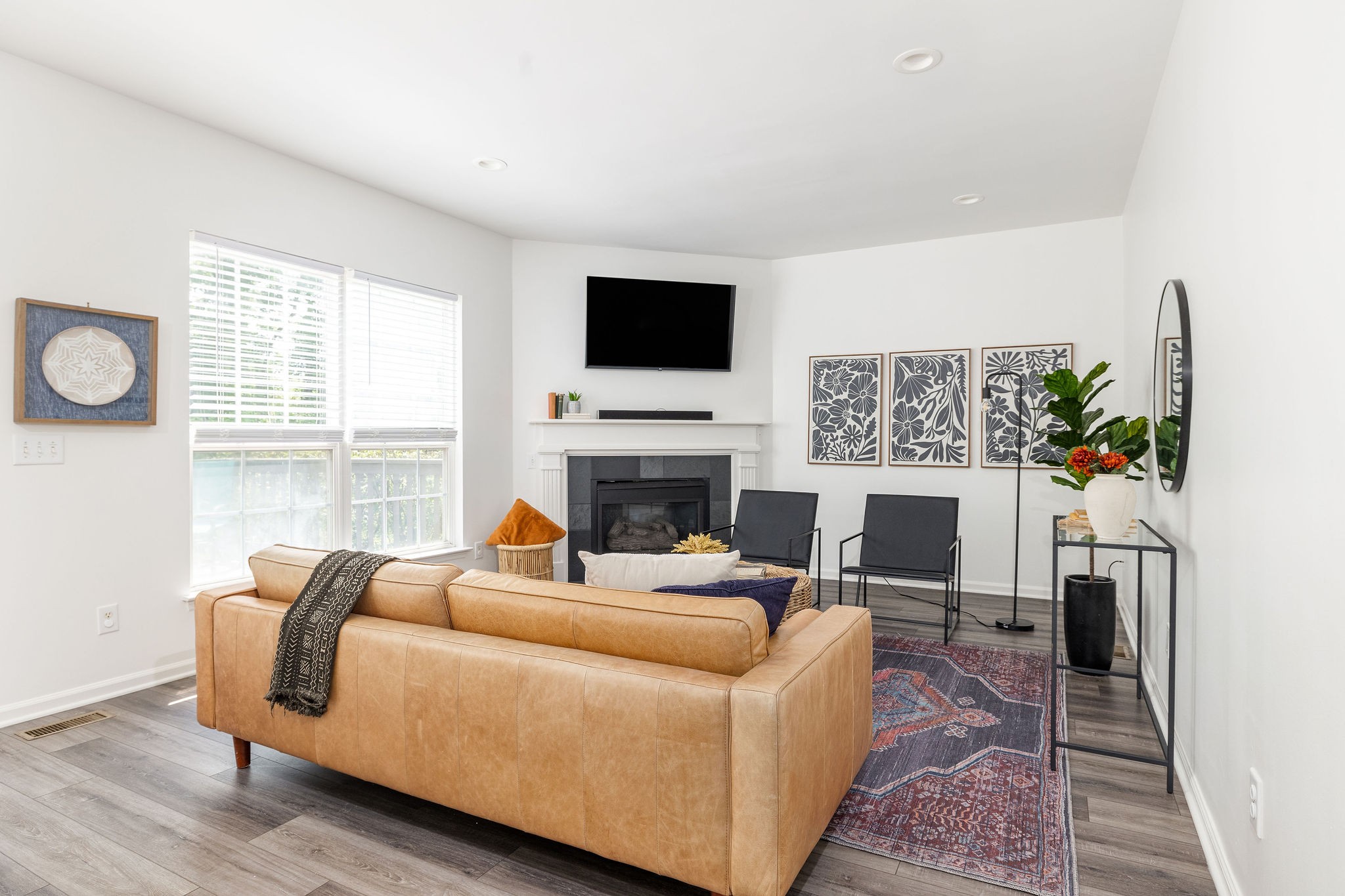 310 Devonshire Drive Franklin, TN 37064 - Photo 16 of 47 a living room with furniture a flat screen tv and a fireplace