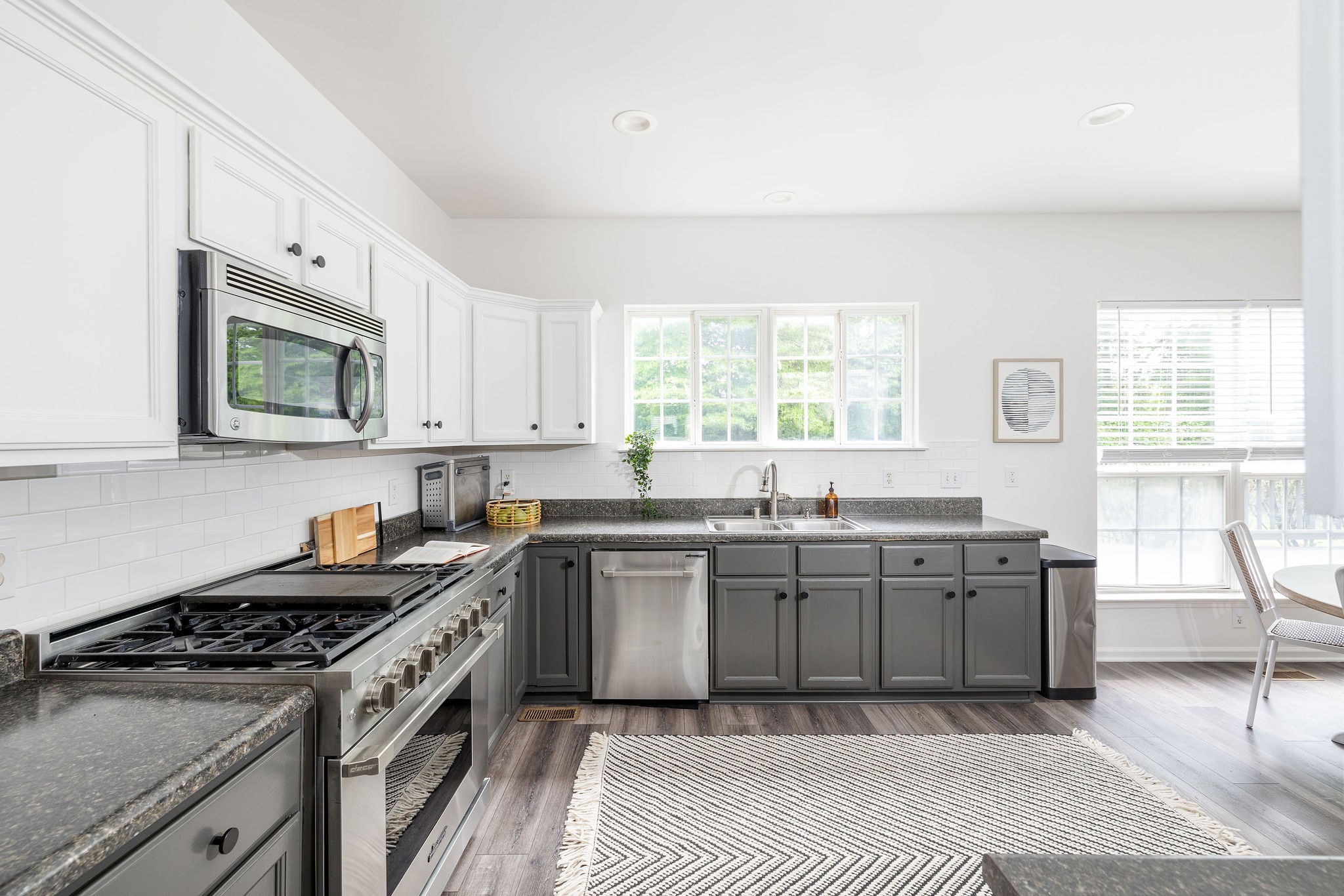 310 Devonshire Drive Franklin, TN 37064 - Photo 9 of 47 a kitchen with granite countertop a stove top oven sink and cabinets