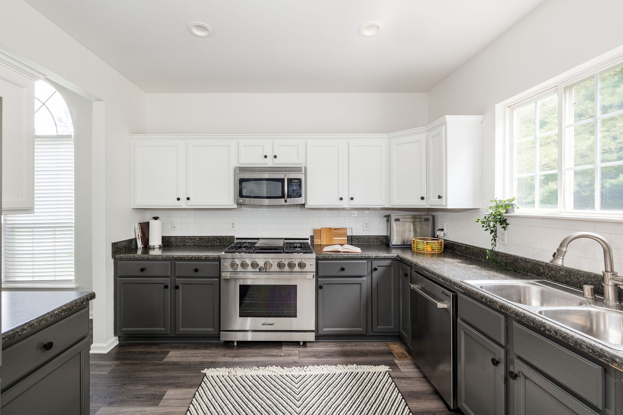 310 Devonshire Drive Franklin, TN 37064 - Photo 10 of 47 a kitchen with stainless steel appliances a stove sink and cabinets