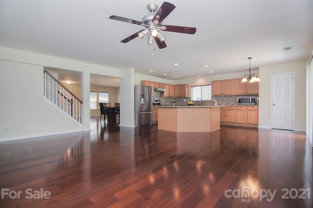 9029 Seamill Road Charlotte, NC 28278 - Photo 15 of 46 a view of kitchen with stove and wooden floor