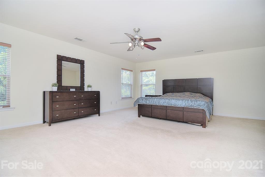9029 Seamill Road Charlotte, NC 28278 - Photo 22 of 46 a living room with furniture and a ceiling fan