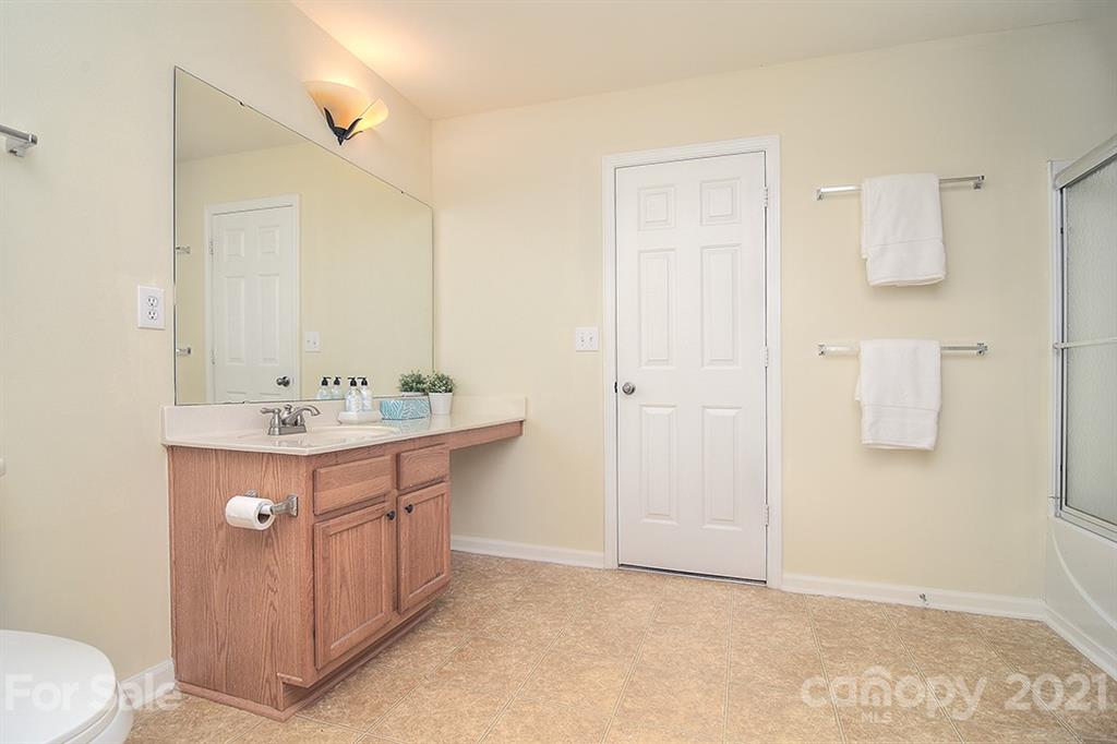 9029 Seamill Road Charlotte, NC 28278 - Photo 24 of 46 a bathroom with a sink a toilet and shower