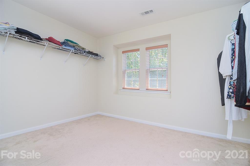 9029 Seamill Road Charlotte, NC 28278 - Photo 26 of 46 a view of a room with rack on the wall and a window
