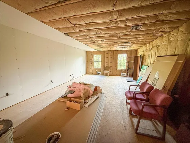 a view of a hall with a couch