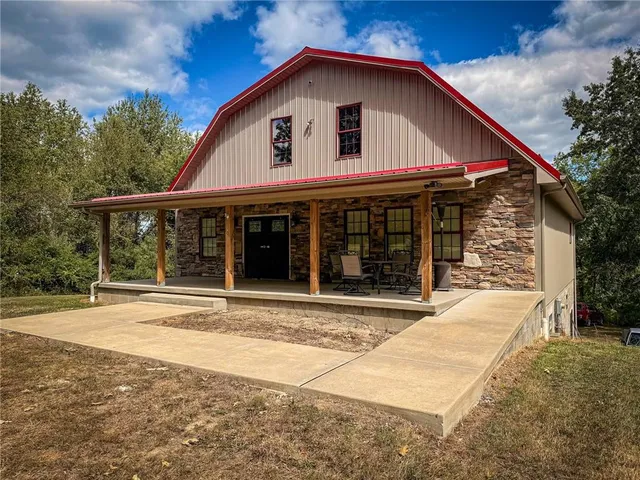 a view of a house with a yard and plants